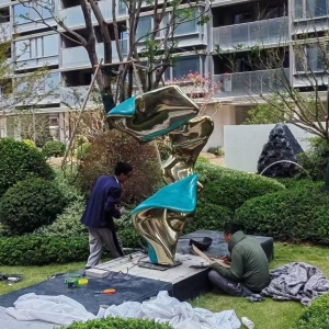 Outdoor custom sculpture installation in a landscape project