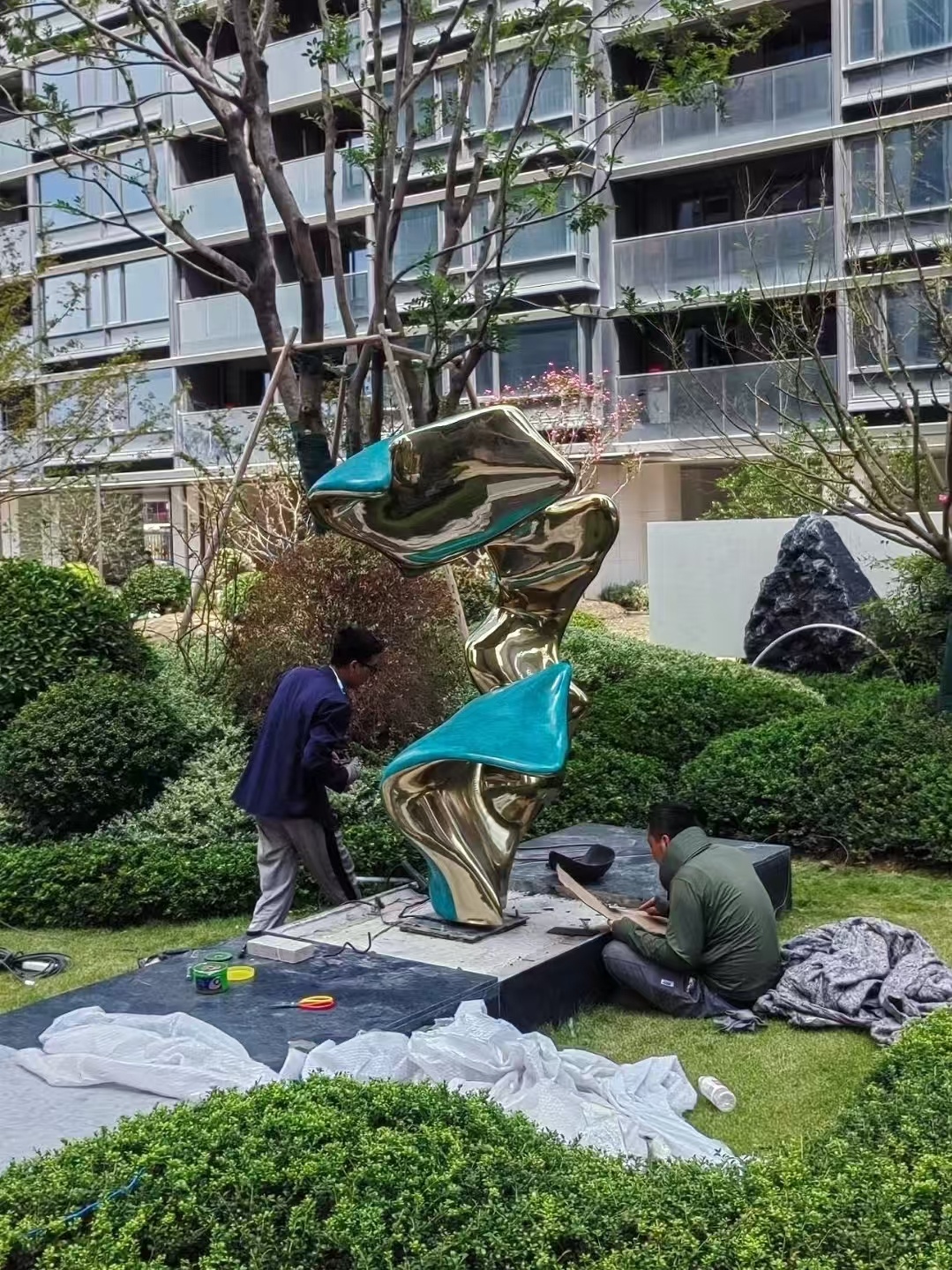 Outdoor custom sculpture installation in a landscape project