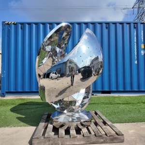 Finished mirror stainless steel sculpture checked outdoors before delivery