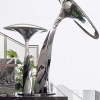Mirror stainless steel sculpture for a bright interior project