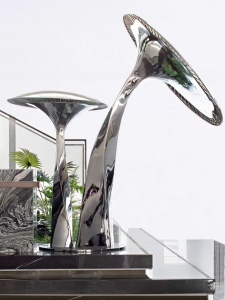 Mirror stainless steel sculpture for a bright interior project