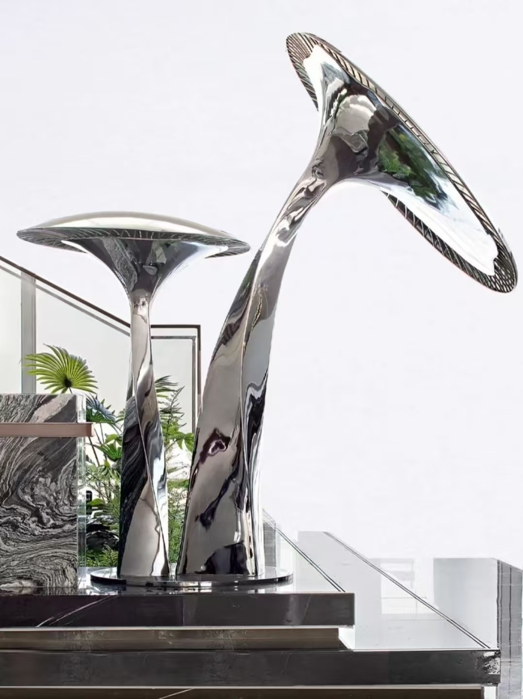 Mirror stainless steel sculpture for a bright interior project