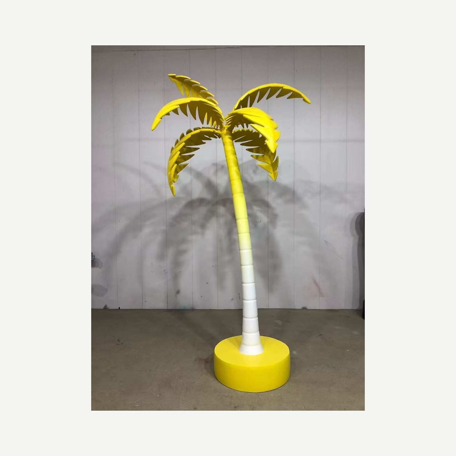 Full-height view of the same custom artificial palm tree prop