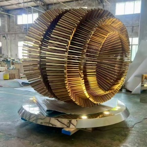 Workshop completion view of the same layered ring stainless steel sculpture