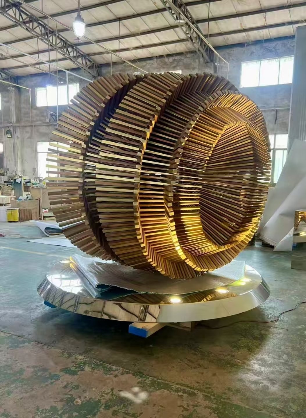 Workshop completion view of the same layered ring stainless steel sculpture