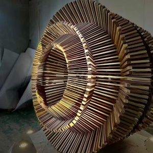 Layer spacing and bronze-tone finish detail on the same ring sculpture