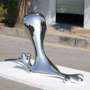 Second angle of the same chrome-finish organic sculpture