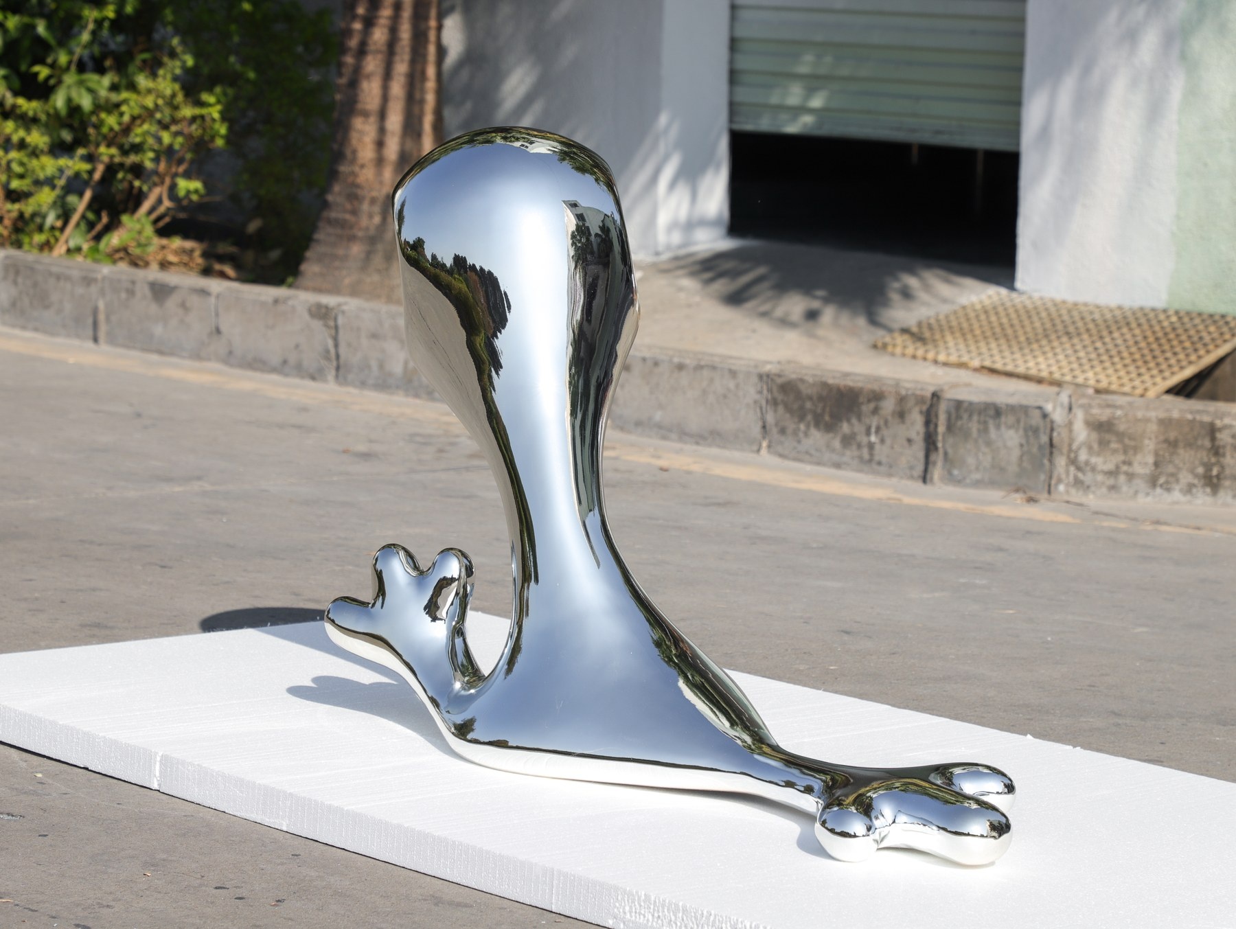 Second angle of the same chrome-finish organic sculpture