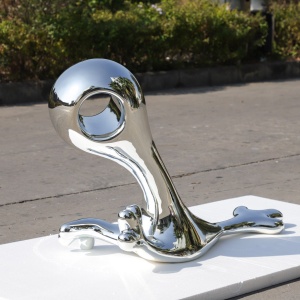 Rear three-quarter view of the same chrome-finish organic sculpture