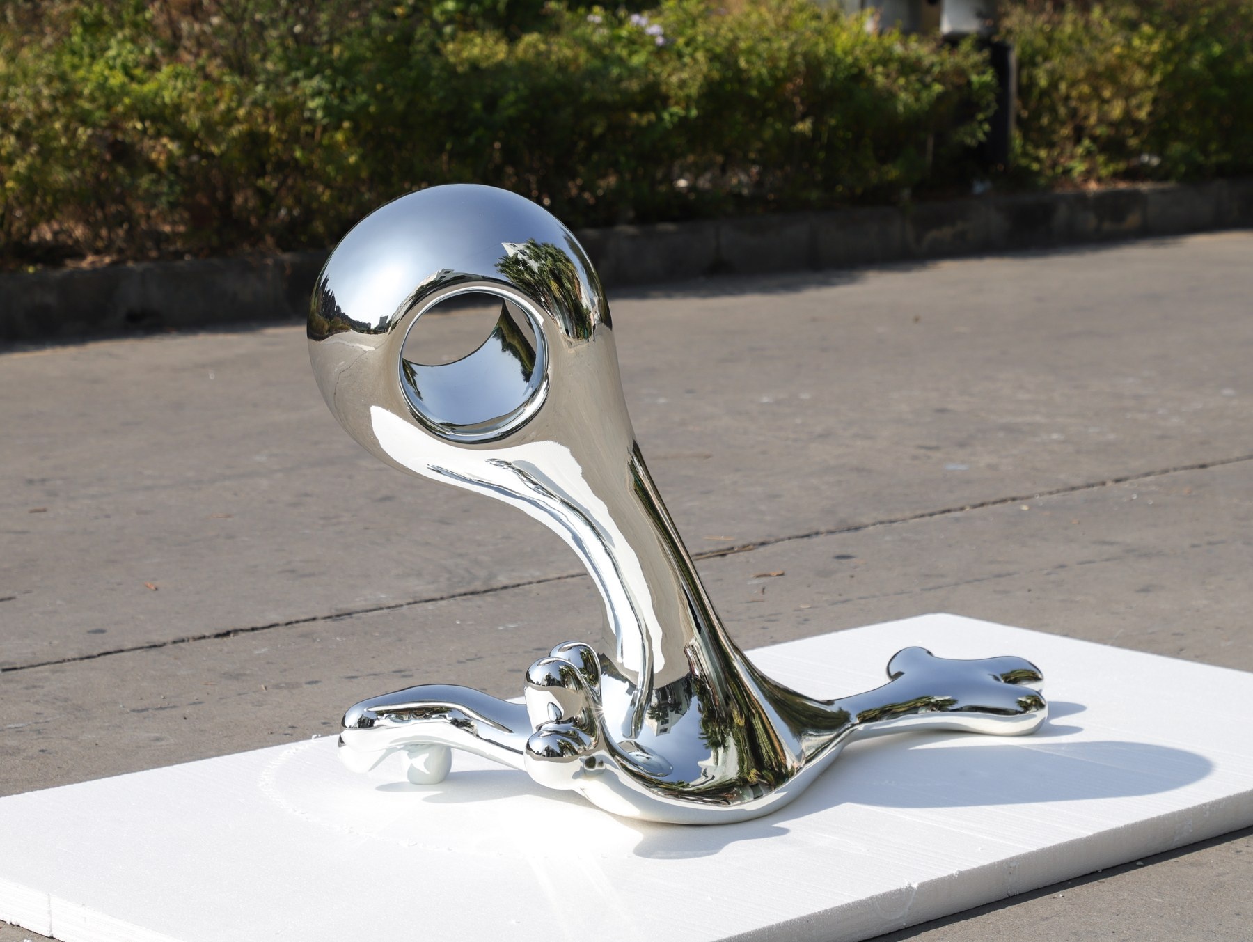 Rear three-quarter view of the same chrome-finish organic sculpture