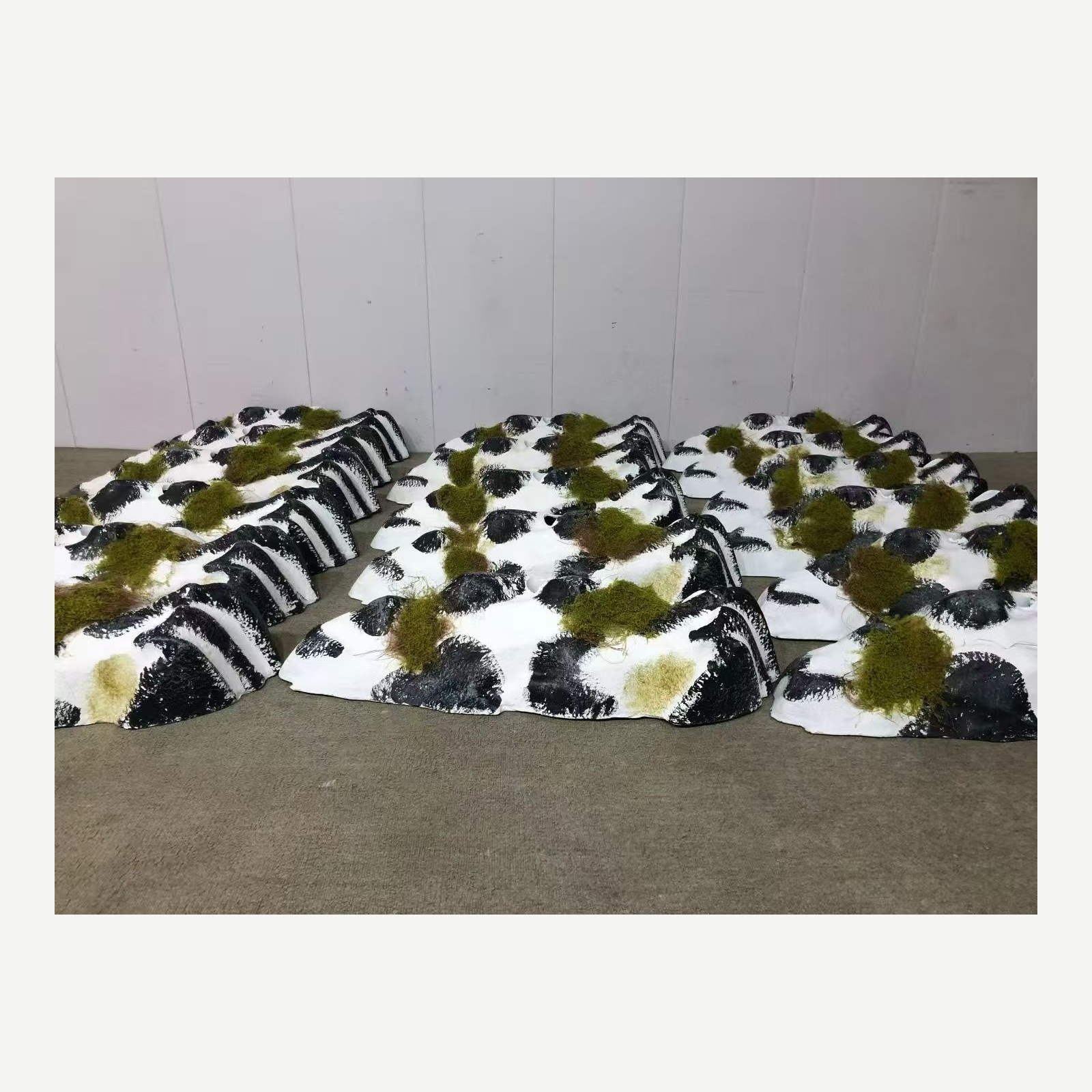 Completed modular faux rock and moss display prop set