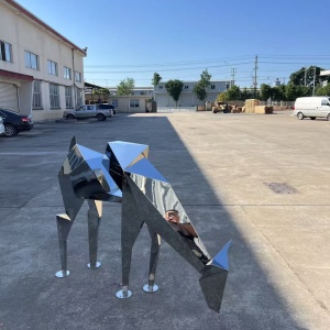 Three-quarter view of the same geometric stainless steel deer sculpture