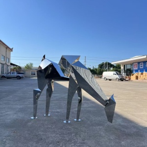 Front view of the same geometric deer sculpture