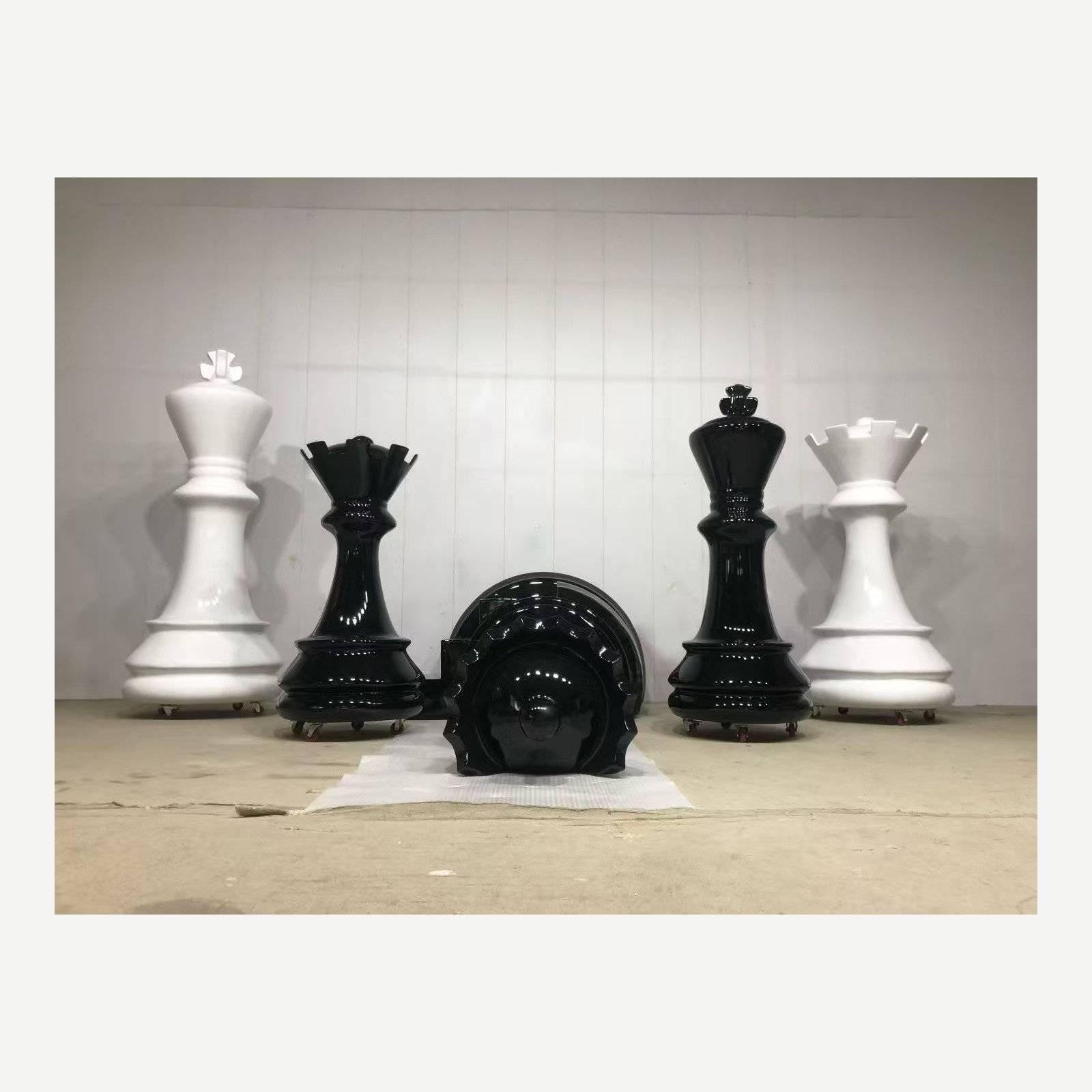 Coordinated giant black and white chess piece display props