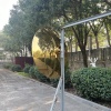 Finished golden mirror stainless steel disc sculpture front view