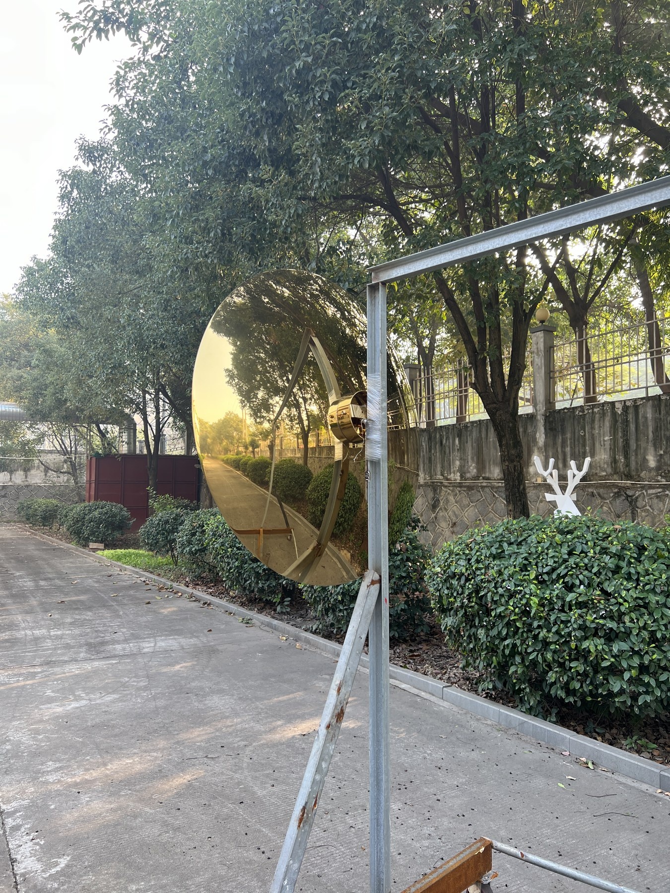 Finished golden mirror stainless steel disc sculpture front view