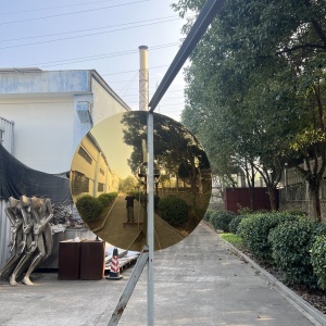 Second view of the same golden mirror stainless steel disc sculpture