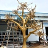 Completed golden stainless steel tree sculpture in the workshop