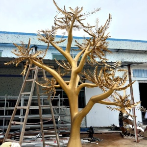 Completed golden stainless steel tree sculpture in the workshop