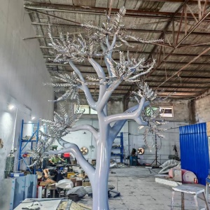 The same stainless steel tree body before application of the final golden finish