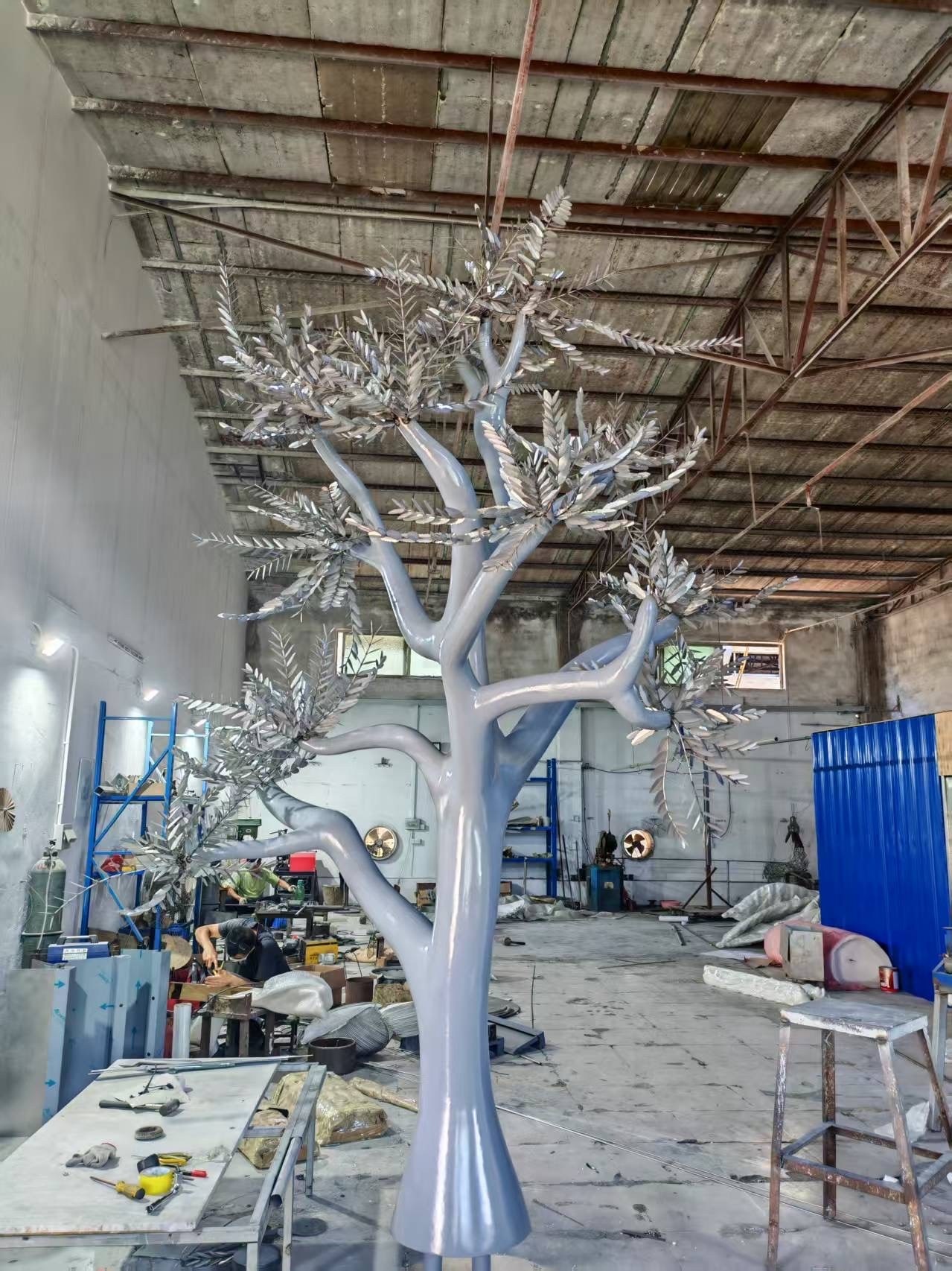 The same stainless steel tree body before application of the final golden finish