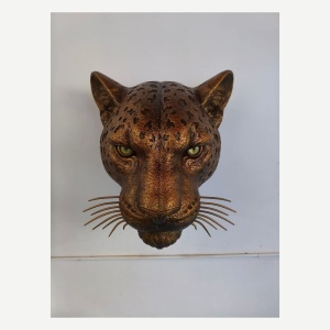 Front view of a custom leopard head wall sculpture