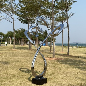 Installed landscape view of the same branching ribbon sculpture