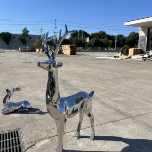 Second project view of the same stainless steel deer sculpture group