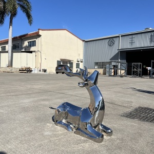 Coordinated standing and reclining deer sculptures from the same project