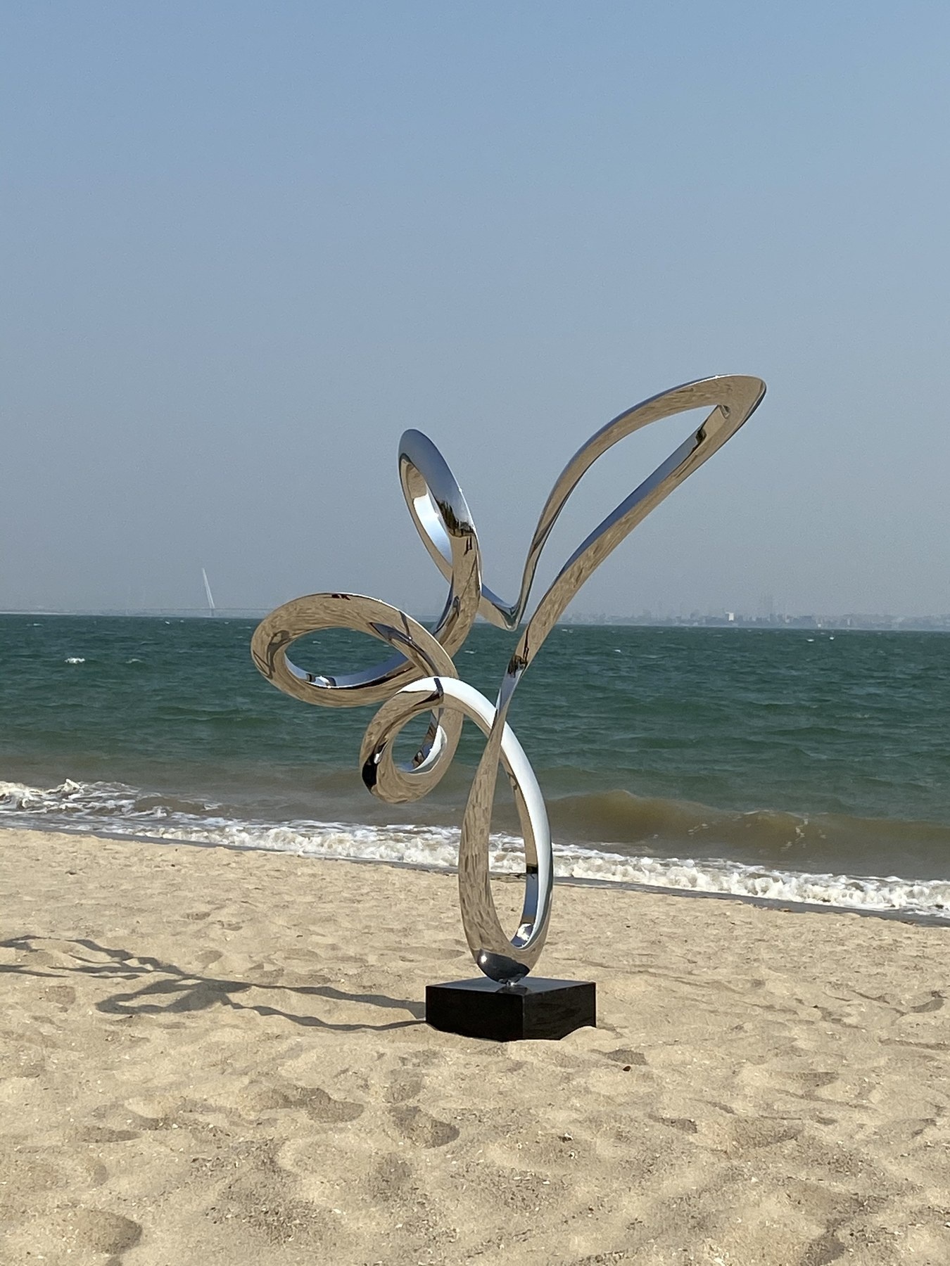 Second angle of the same flowing loop stainless steel sculpture