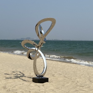 Rear view of the same mirror stainless steel loop sculpture