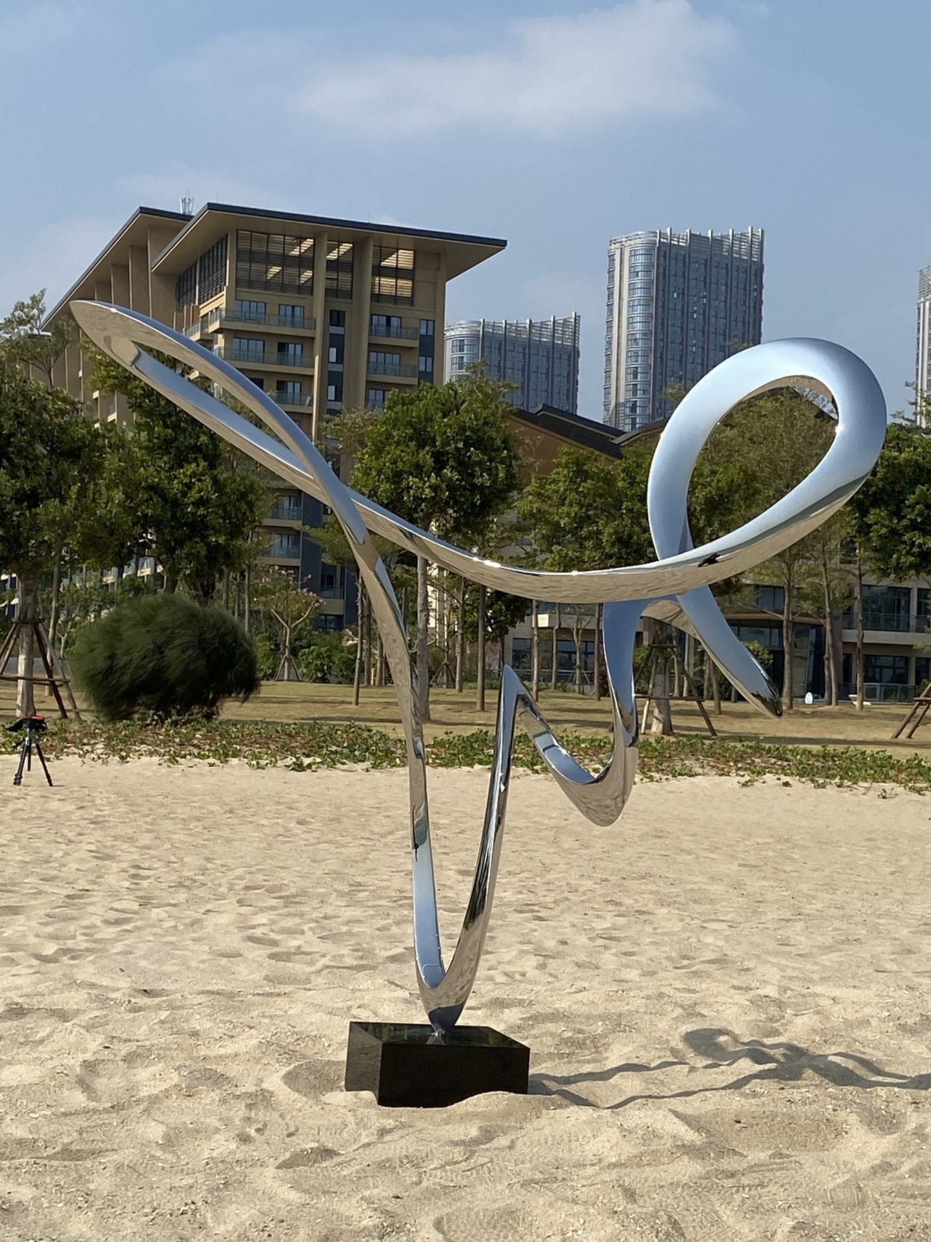 Installed project view of the same stainless steel loop sculpture