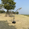 Installed mirror stainless steel loop sculpture in an outdoor landscape