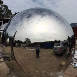 Mirror stainless steel sphere surface and reflection detail