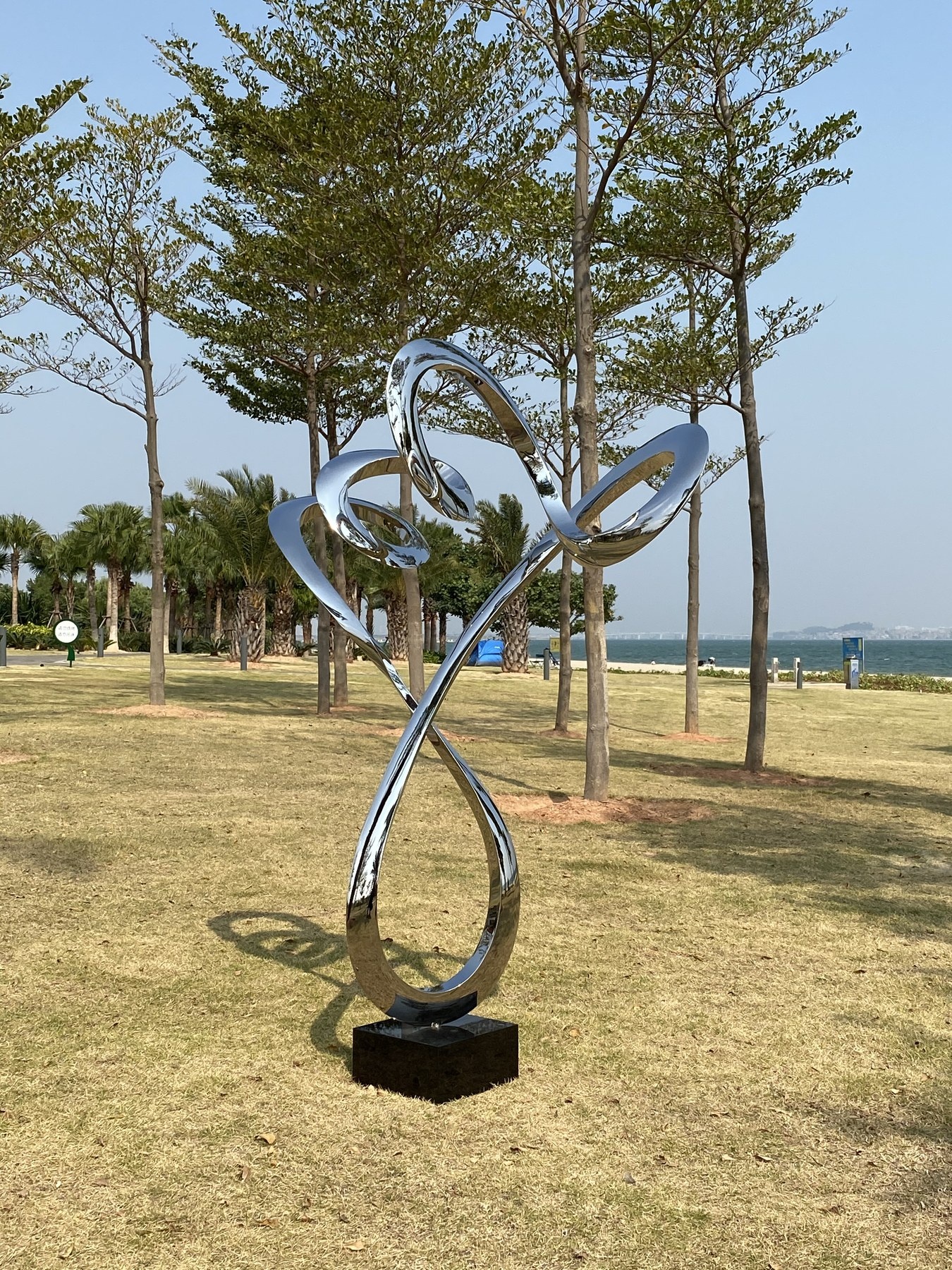Second view of the same mirror stainless steel spiral sculpture