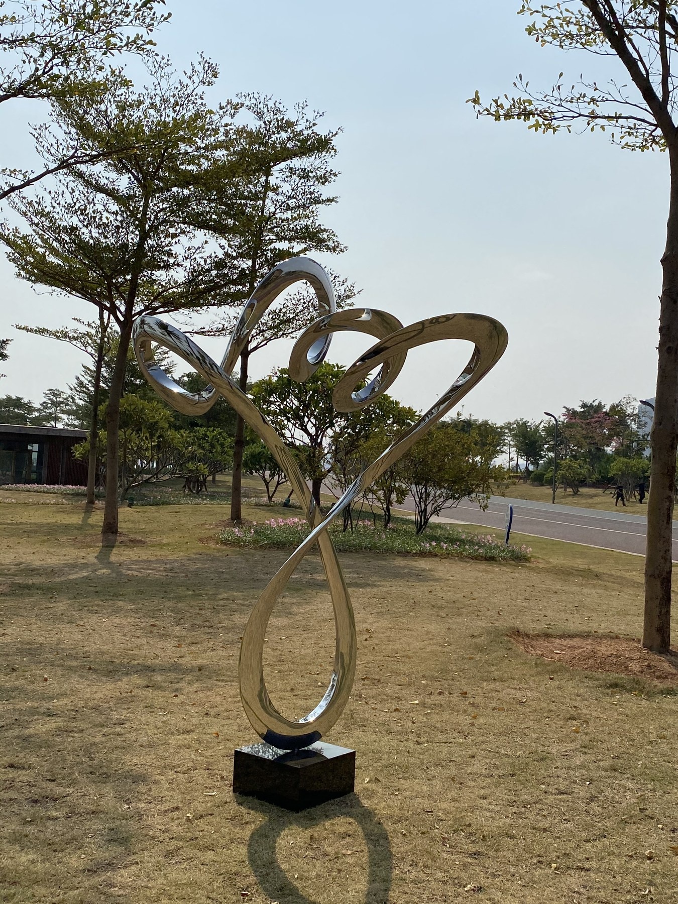Side view of the same stainless steel spiral sculpture