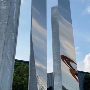 Reflective vertical blade detail from the same stainless steel sculpture project
