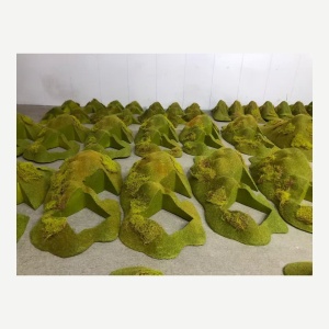 Workshop arrangement of the same moss-covered display modules