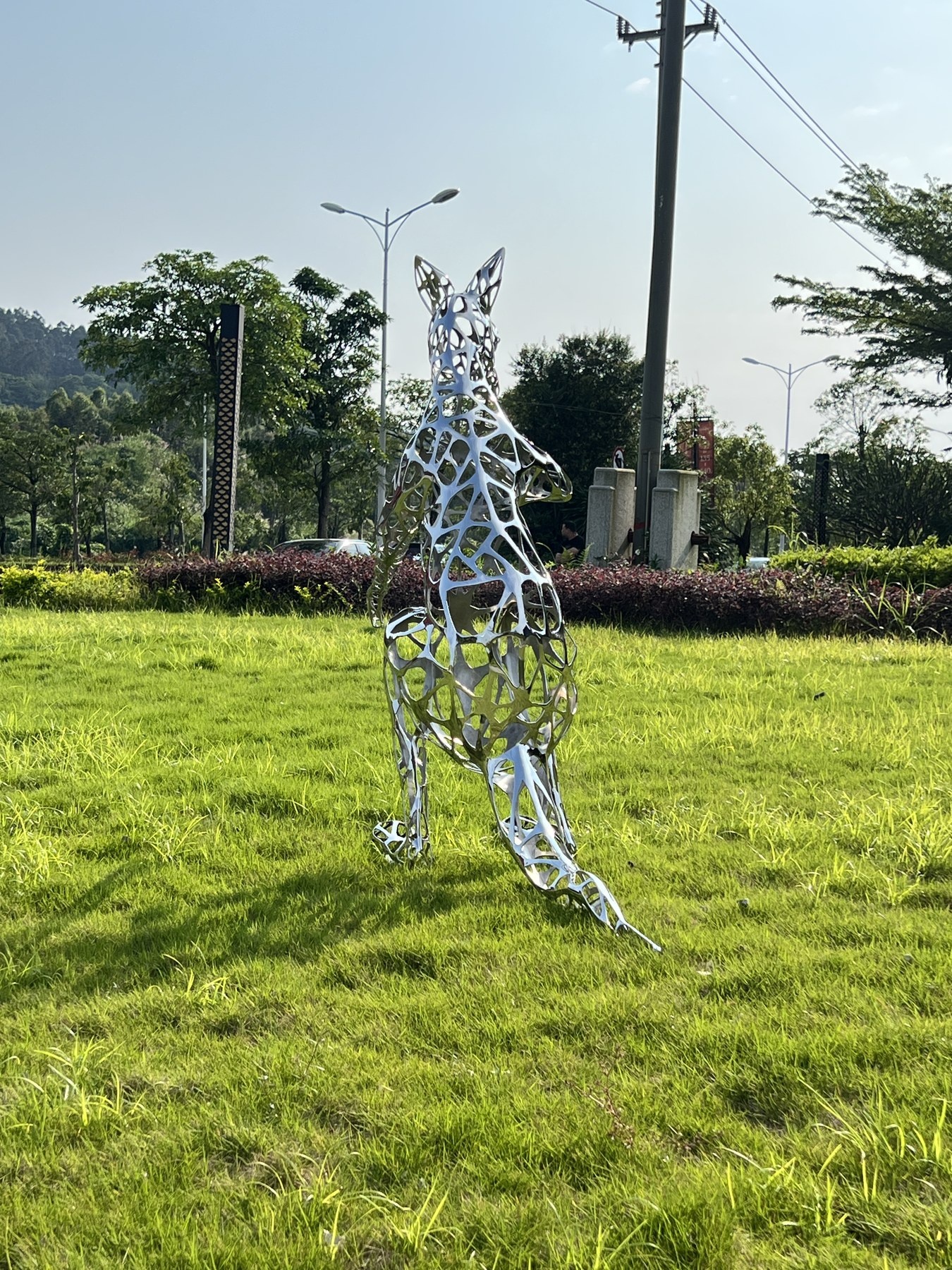 Second outdoor view of the same openwork kangaroo sculpture