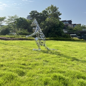 Side view of the same stainless steel kangaroo sculpture