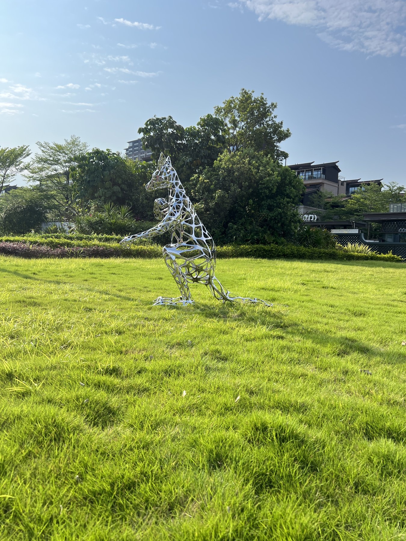 Side view of the same stainless steel kangaroo sculpture