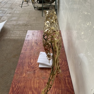 Rear and side view of the same openwork leopard sculpture