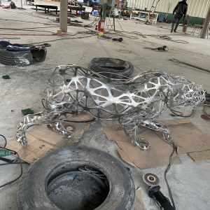Fabrication-stage view of the same openwork leopard structure