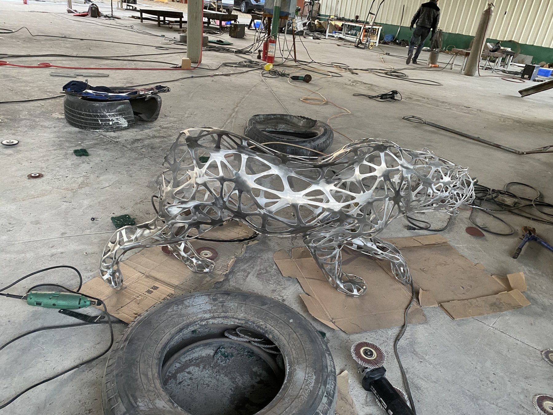 Fabrication-stage view of the same openwork leopard structure