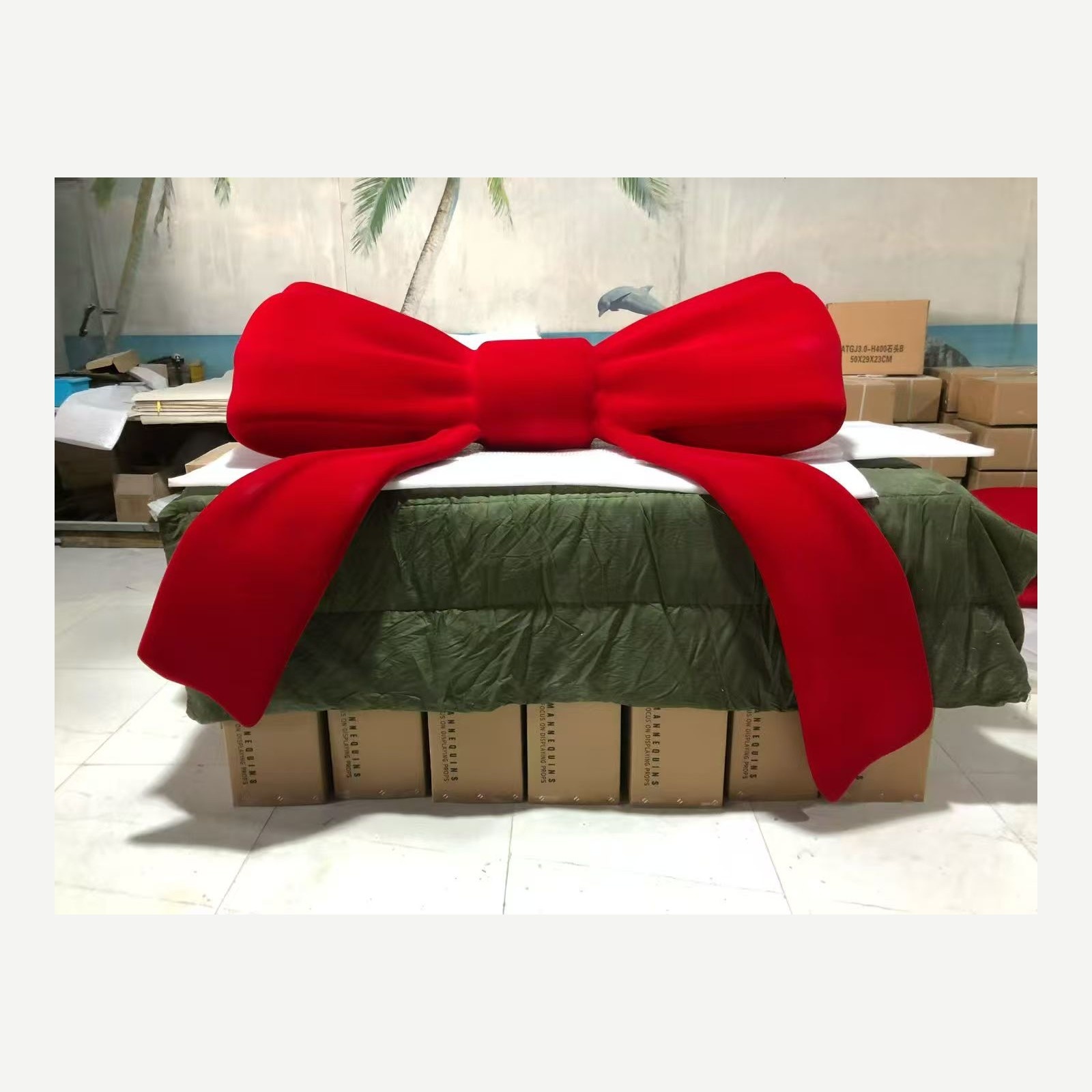 Full view of the same custom red bow display prop