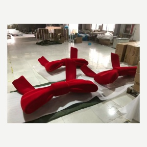 Side angle showing the ribbon form of the same oversized bow prop