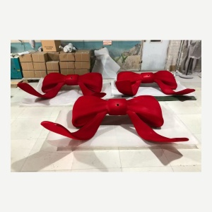 Finished red bow display prop from the same fabrication set