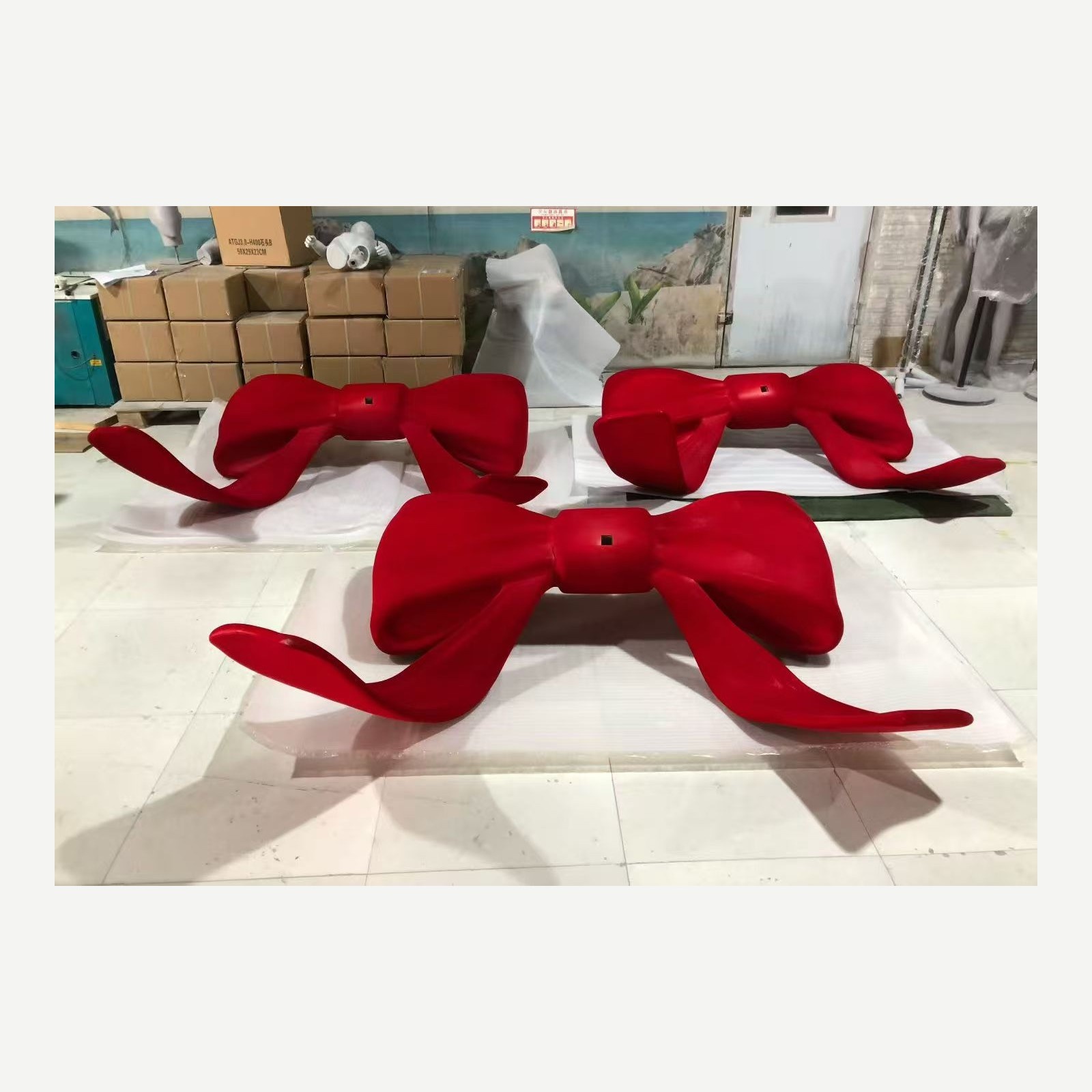Finished red bow display prop from the same fabrication set