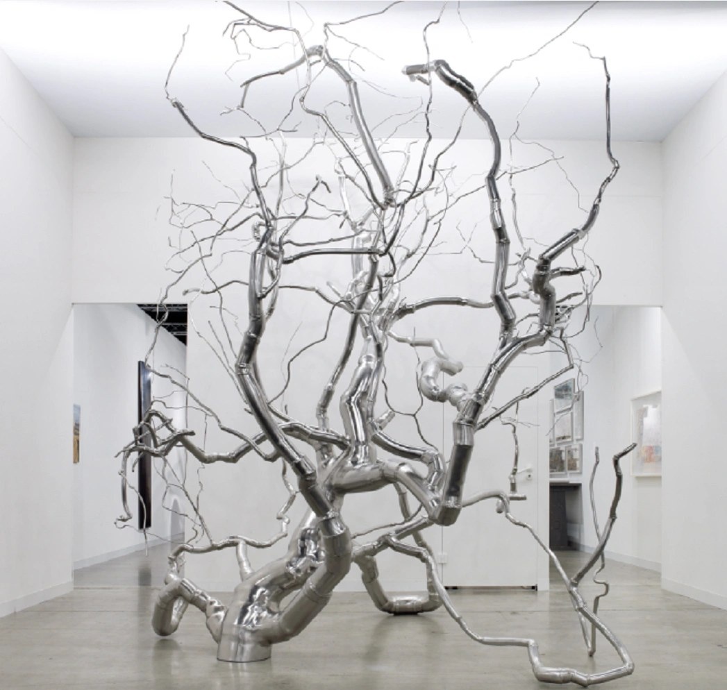 Completed stainless steel branch sculpture in an interior art installation