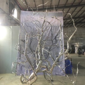 Front workshop view of the same organic branch sculpture assembly